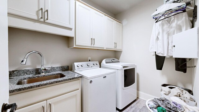 203 W Chandler Ct, Mount Juliet, TN 37122 - washroom featuring cabinet space, independent washer and dryer, light wood-style flooring, and baseboards