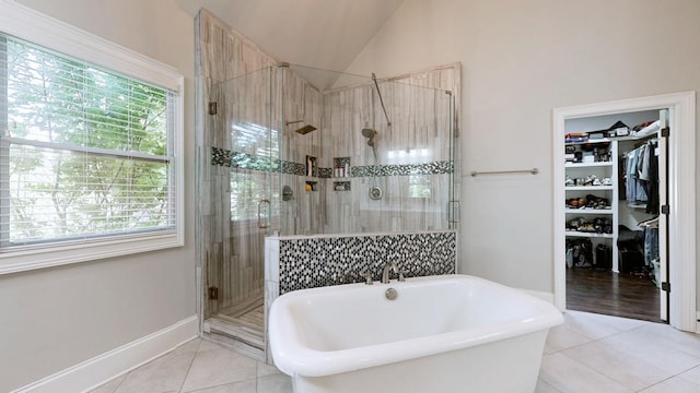 203 W Chandler Ct, Mount Juliet, TN 37122 - bathroom featuring tile patterned flooring, a soaking tub, plenty of natural light, and vaulted ceiling
