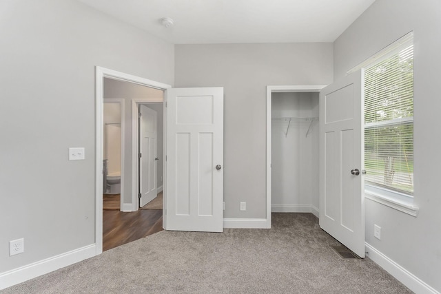 201 Hayes St, Smithville, TN 37166 - unfurnished bedroom with carpet flooring, baseboards, and a closet