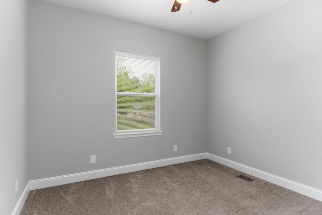 201 Hayes St, Smithville, TN 37166 - empty room featuring dark carpet, ceiling fan, and baseboards