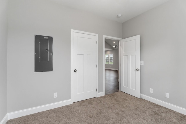 201 Hayes St, Smithville, TN 37166 - unfurnished bedroom featuring electric panel, carpet floors, and baseboards