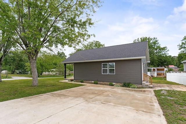 201 Hayes St, Smithville, TN 37166 - view of side of property with concrete driveway and a shingled roof