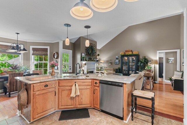 102 Lorelle Cir, Portland, TN 37148 - kitchen with dishwasher, a sink, open floor plan, light stone countertops, and pendant lighting