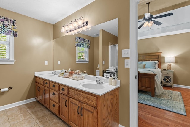 102 Lorelle Cir, Portland, TN 37148 - bathroom with a ceiling fan, baseboards, double vanity, a shower with door, and ensuite bath