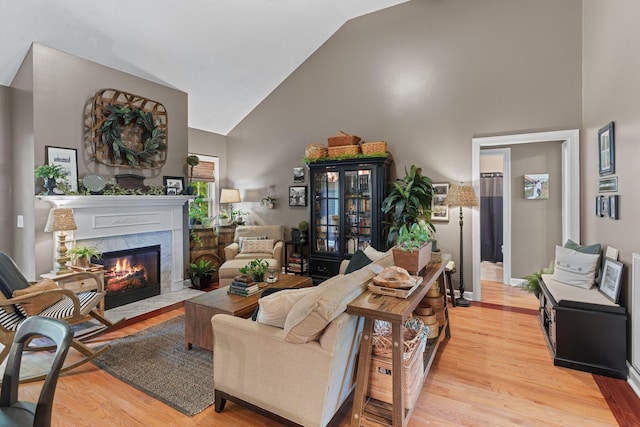 102 Lorelle Cir, Portland, TN 37148 - living room with high vaulted ceiling, light wood-type flooring, and a premium fireplace