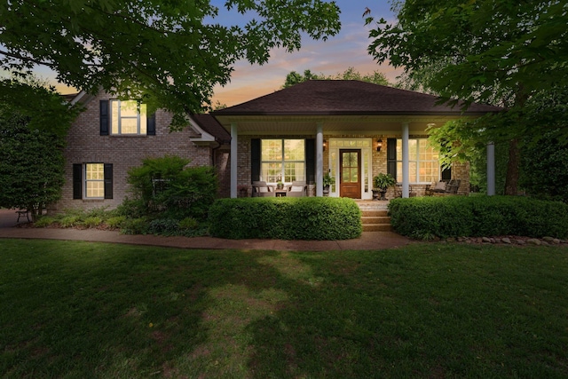 102 Lorelle Cir, Portland, TN 37148 - view of front of home featuring covered porch, a lawn, and brick siding