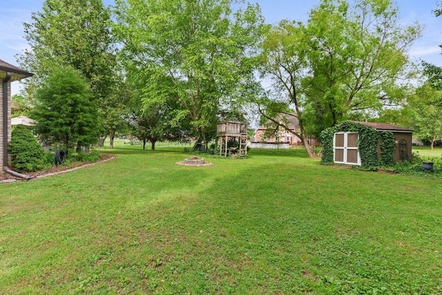 102 Lorelle Cir, Portland, TN 37148 - view of green lawn with a shed, an outdoor structure, and a playground