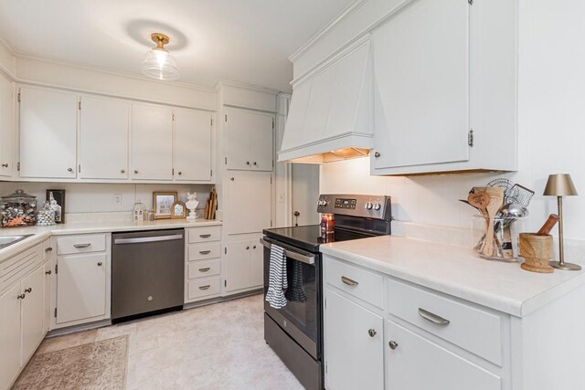 1006 Kirkwood Ave, Murfreesboro, TN 37130 - kitchen with appliances with stainless steel finishes, light countertops, white cabinetry, custom range hood, and light flooring