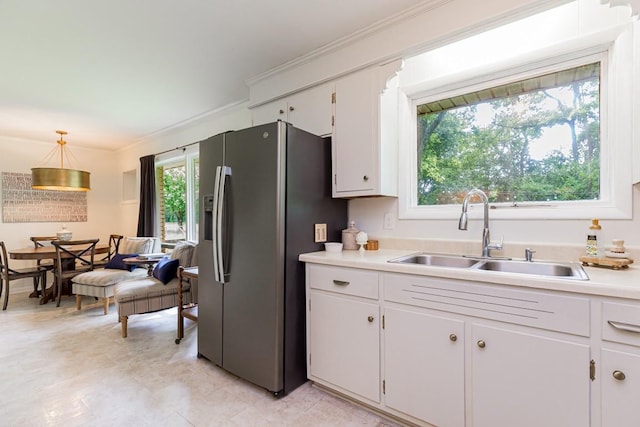 1006 Kirkwood Ave, Murfreesboro, TN 37130 - kitchen with a sink, stainless steel fridge with ice dispenser, light countertops, white cabinetry, and crown molding