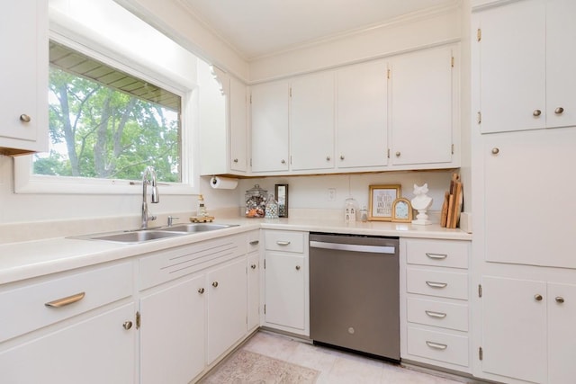 1006 Kirkwood Ave, Murfreesboro, TN 37130 - kitchen with stainless steel dishwasher, a sink, light countertops, and white cabinetry