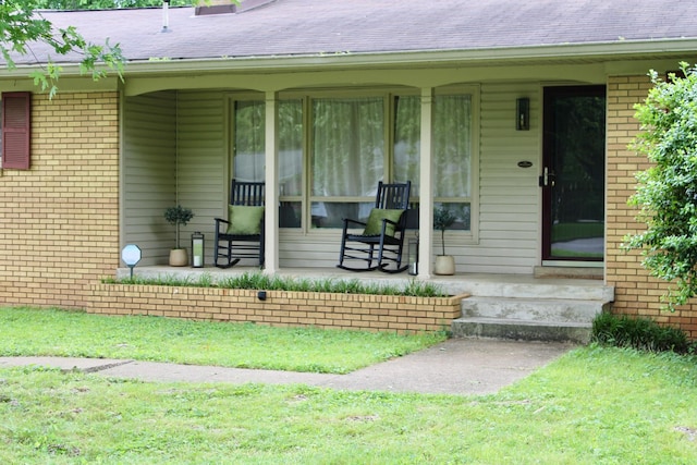 1006 Kirkwood Ave, Murfreesboro, TN 37130 - property entrance with brick siding, a porch, and a shingled roof