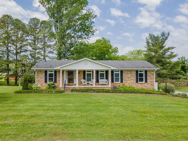 1205 Parker Dr, Pulaski, TN 38478 - single story home featuring a porch, a front yard, and brick siding
