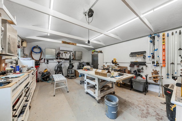 1205 Parker Dr, Pulaski, TN 38478 - garage featuring a workshop area and a wall mounted air conditioner