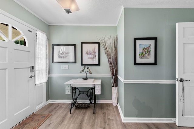 1205 Parker Dr, Pulaski, TN 38478 - foyer entrance featuring wood finished floors, healthy amount of natural light, ornamental molding, and baseboards
