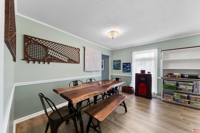 1205 Parker Dr, Pulaski, TN 38478 - dining space with crown molding, wood finished floors, and a textured ceiling