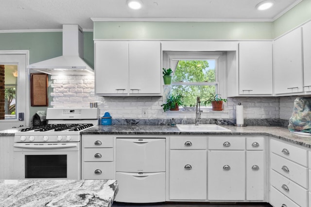 1205 Parker Dr, Pulaski, TN 38478 - kitchen featuring white range with gas cooktop, wall chimney range hood, a sink, white cabinets, and backsplash