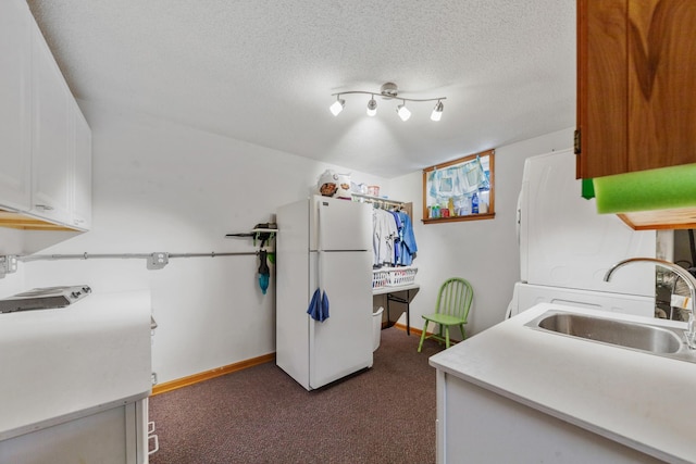 1205 Parker Dr, Pulaski, TN 38478 - kitchen featuring freestanding refrigerator, a sink, dark carpet, baseboards, and a textured ceiling