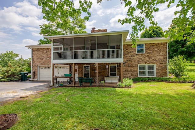 1205 Parker Dr, Pulaski, TN 38478 - back of house with asphalt driveway, brick siding, a lawn, a sunroom, and a chimney