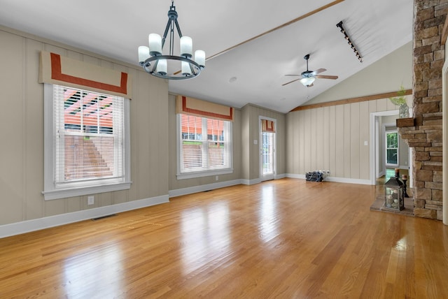 220 Porters Bluff Rd, Clarksville, TN 37040 - unfurnished living room with light wood-type flooring, a chandelier, a ceiling fan, high vaulted ceiling, and baseboards