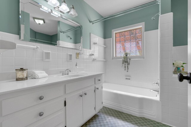 220 Porters Bluff Rd, Clarksville, TN 37040 - full bathroom with tile patterned floors, tile walls, vanity, and wainscoting