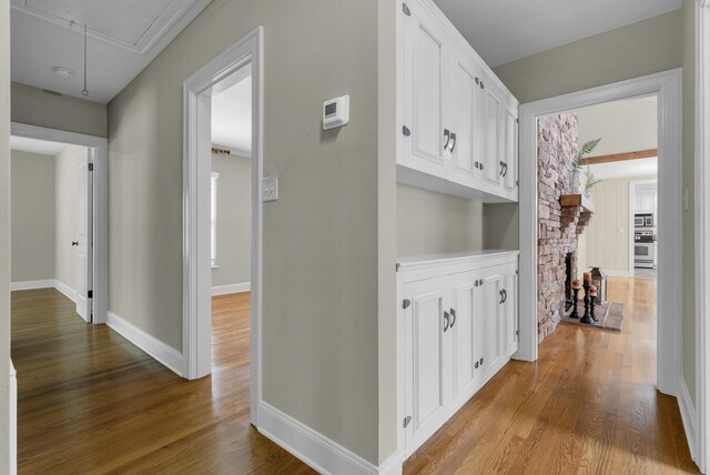 220 Porters Bluff Rd, Clarksville, TN 37040 - hall with attic access, wood finished floors, and baseboards