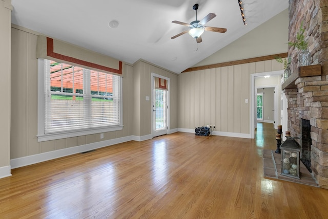 220 Porters Bluff Rd, Clarksville, TN 37040 - unfurnished living room featuring light wood-style floors, a ceiling fan, healthy amount of natural light, and high vaulted ceiling