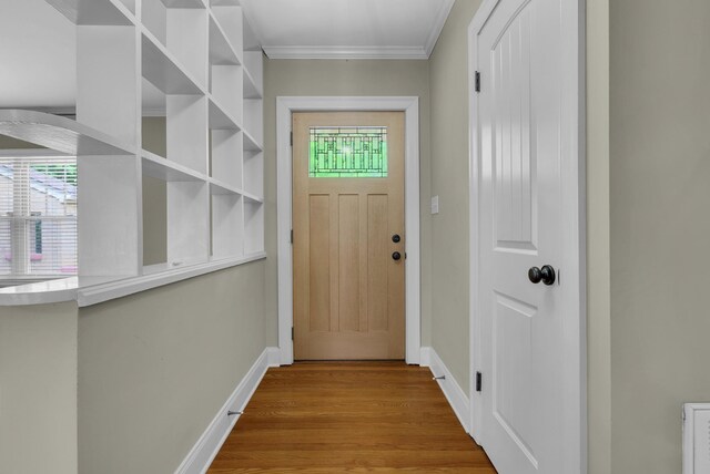 220 Porters Bluff Rd, Clarksville, TN 37040 - doorway to outside featuring healthy amount of natural light, wood finished floors, baseboards, and ornamental molding