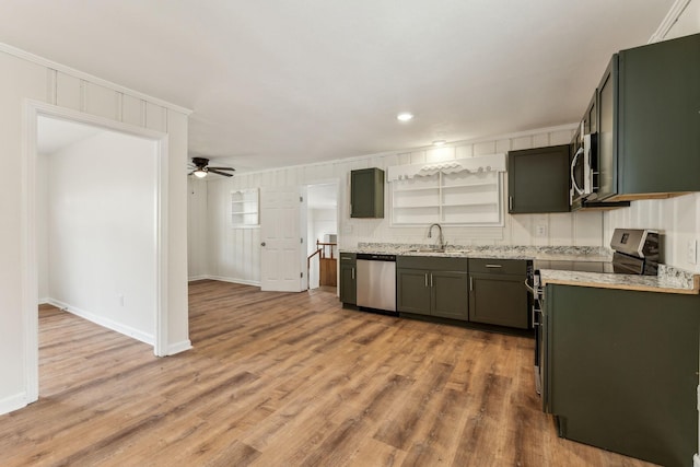 25 Lock Seven Ln, Carthage, TN 37030 - kitchen with stainless steel appliances, a sink, a ceiling fan, light wood-style floors, and baseboards