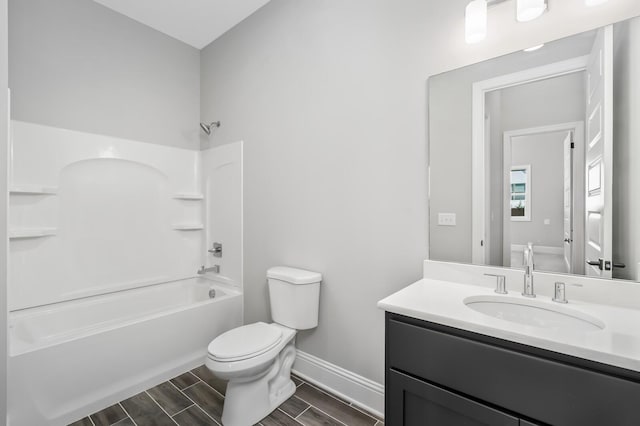 129 Barlow Dr, Franklin, TN 37064 - full bath with toilet, washtub / shower combination, baseboards, vanity, and wood tiled floors