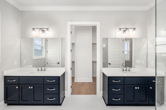 129 Barlow Dr, Franklin, TN 37064 - bathroom with ornamental molding, two vanities, baseboards, and tile patterned floors