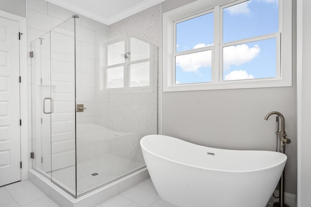 129 Barlow Dr, Franklin, TN 37064 - bathroom with crown molding, a stall shower, a freestanding tub, and tile patterned floors
