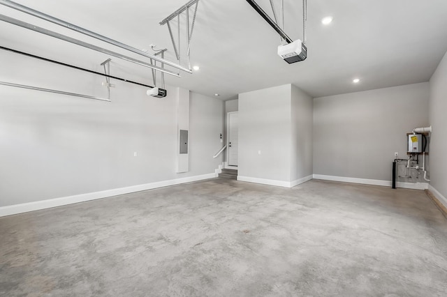 129 Barlow Dr, Franklin, TN 37064 - garage with a garage door opener, electric panel, baseboards, water heater, and recessed lighting