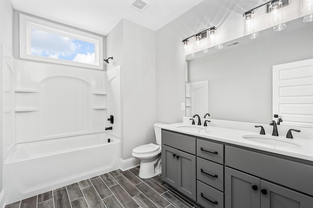 129 Barlow Dr, Franklin, TN 37064 - full bath with toilet, double vanity, shower / bathtub combination, wood finish floors, and baseboards