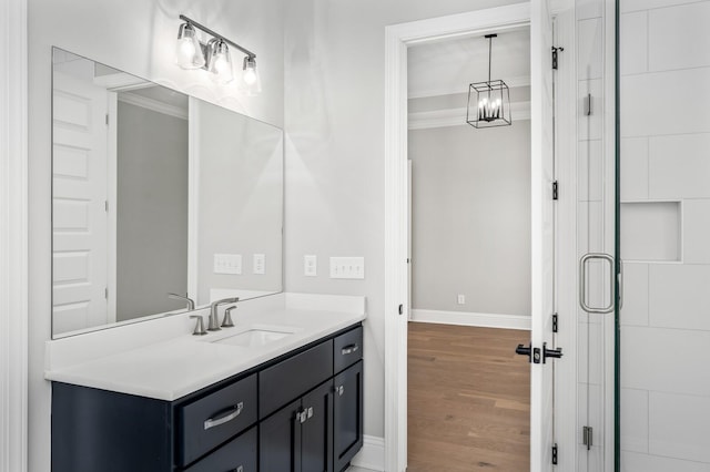 129 Barlow Dr, Franklin, TN 37064 - bathroom featuring crown molding, wood finished floors, baseboards, vanity, and a stall shower