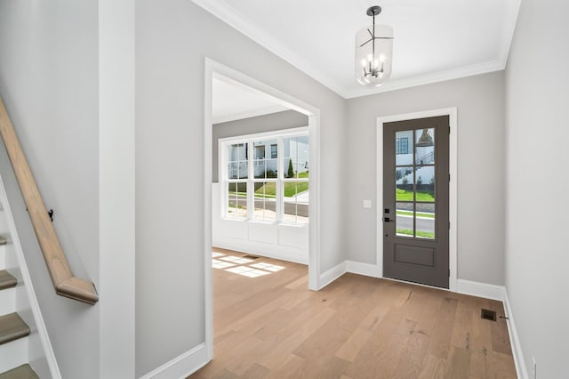 129 Barlow Dr, Franklin, TN 37064 - entryway with crown molding, a chandelier, baseboards, light wood finished floors, and stairs
