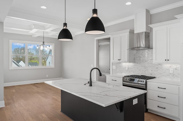 129 Barlow Dr, Franklin, TN 37064 - kitchen featuring a sink, gas stove, wall chimney range hood, backsplash, and a center island with sink