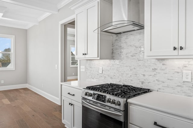 129 Barlow Dr, Franklin, TN 37064 - kitchen with stainless steel range with gas cooktop, wall chimney exhaust hood, crown molding, light countertops, and white cabinetry