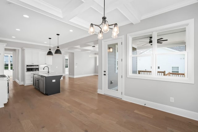 129 Barlow Dr, Franklin, TN 37064 - kitchen featuring stainless steel appliances, light countertops, baseboards, coffered ceiling, and white cabinets