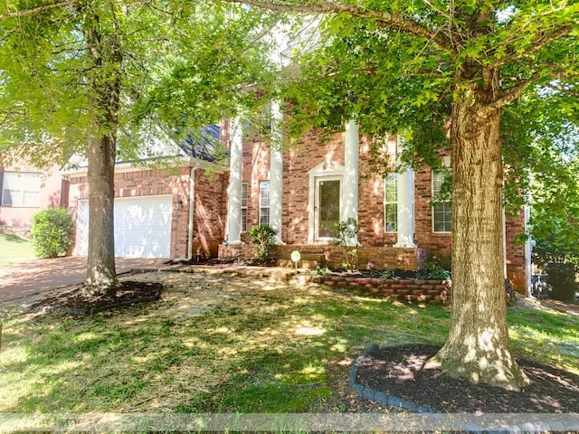 4002 Lattigo Ct, Spring Hill, TN 37174 - obstructed view of property with concrete driveway, brick siding, and an attached garage