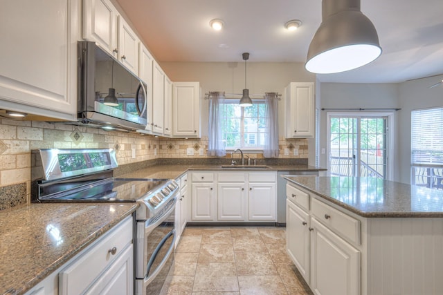 4002 Lattigo Ct, Spring Hill, TN 37174 - kitchen featuring appliances with stainless steel finishes, a sink, decorative backsplash, and white cabinetry
