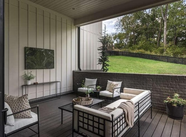 wooden deck with an outdoor living space