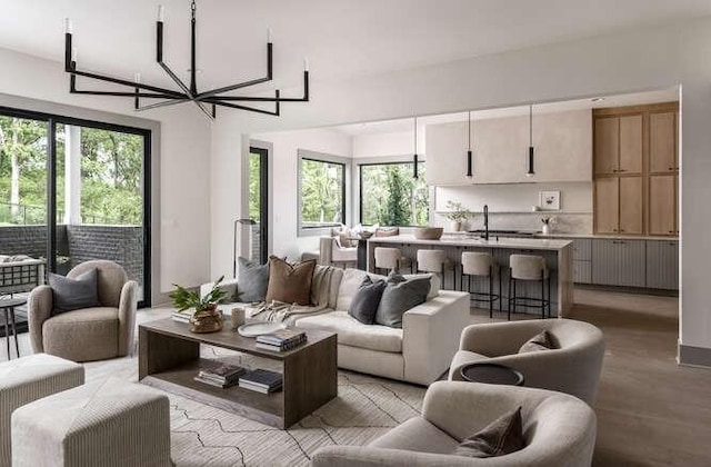 living area with healthy amount of natural light and light wood-type flooring