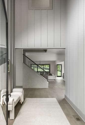 staircase featuring a decorative wall