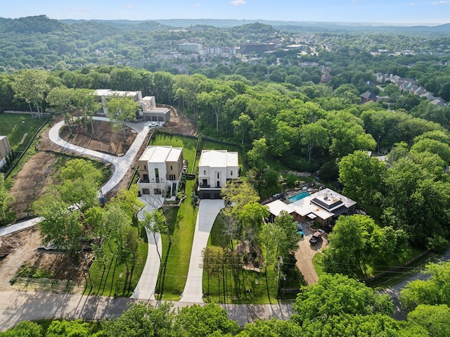 aerial view of property's location with a forest