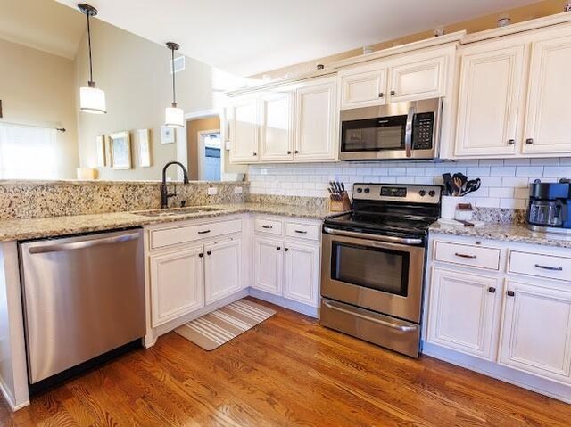 302 Janie St, Smyrna, TN 37167 - kitchen featuring appliances with stainless steel finishes, a sink, and white cabinets