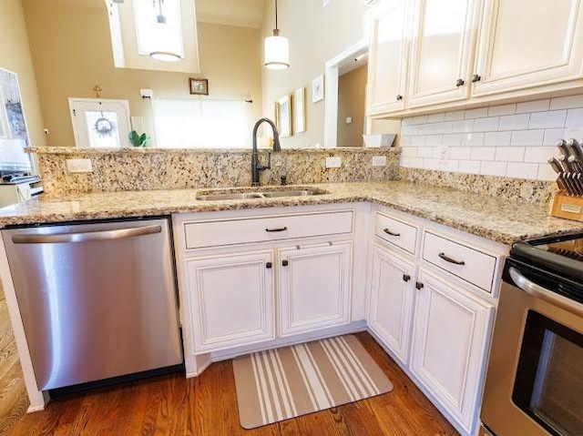 302 Janie St, Smyrna, TN 37167 - kitchen with stainless steel appliances, a sink, wood finished floors, and white cabinets