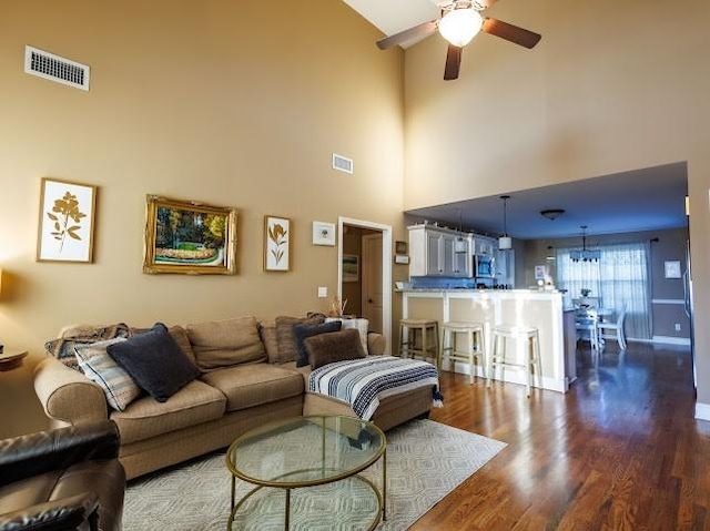 302 Janie St, Smyrna, TN 37167 - living area with a ceiling fan, a towering ceiling, dark wood finished floors, and baseboards