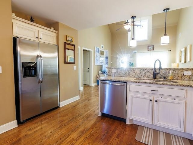 302 Janie St, Smyrna, TN 37167 - kitchen with appliances with stainless steel finishes, a sink, ceiling fan, dark wood finished floors, and white cabinets