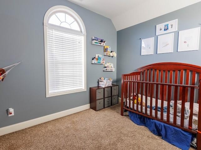 302 Janie St, Smyrna, TN 37167 - carpeted bedroom with lofted ceiling, a crib, and baseboards