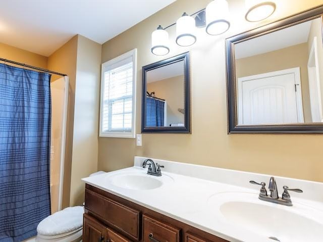 302 Janie St, Smyrna, TN 37167 - bathroom with double vanity, toilet, and shower / bath combo with shower curtain